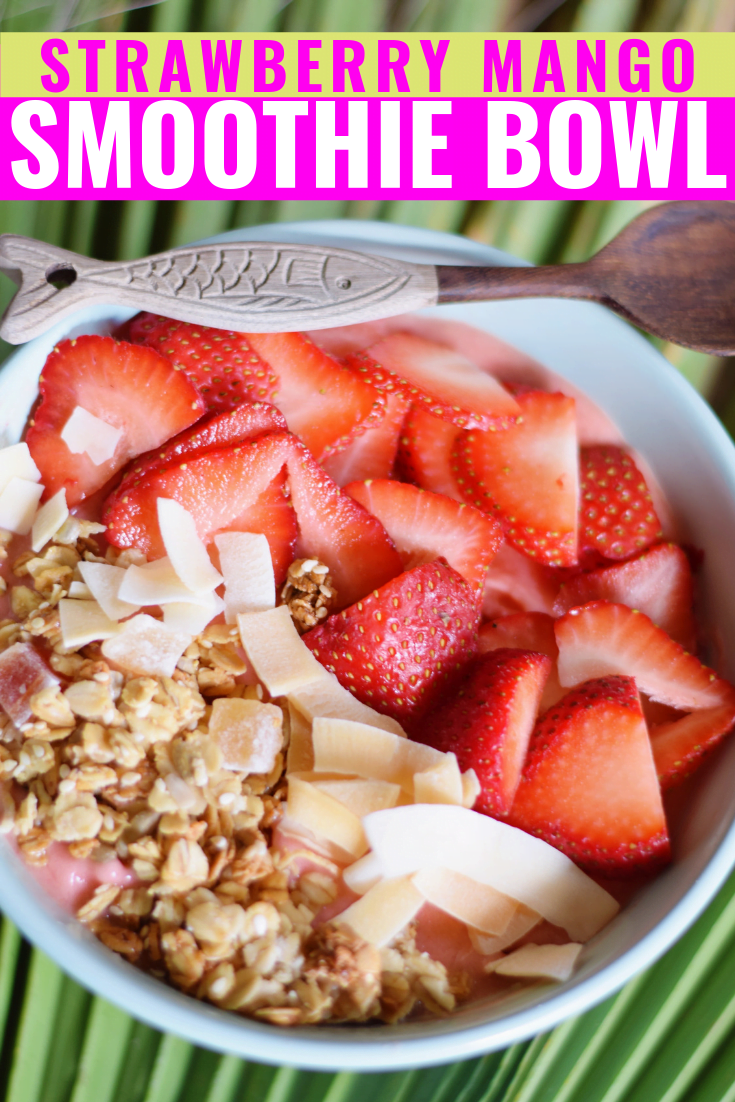 Strawberry Mango Smoothie Bowl - Bowl of strawberries and frozen mangoes blended with frozen banana, macadamia nut milk and lime, topped with granola and coconut and fresh strawberries.  "Strawberry Mango Smoothie Bowl" written as an overlay. 