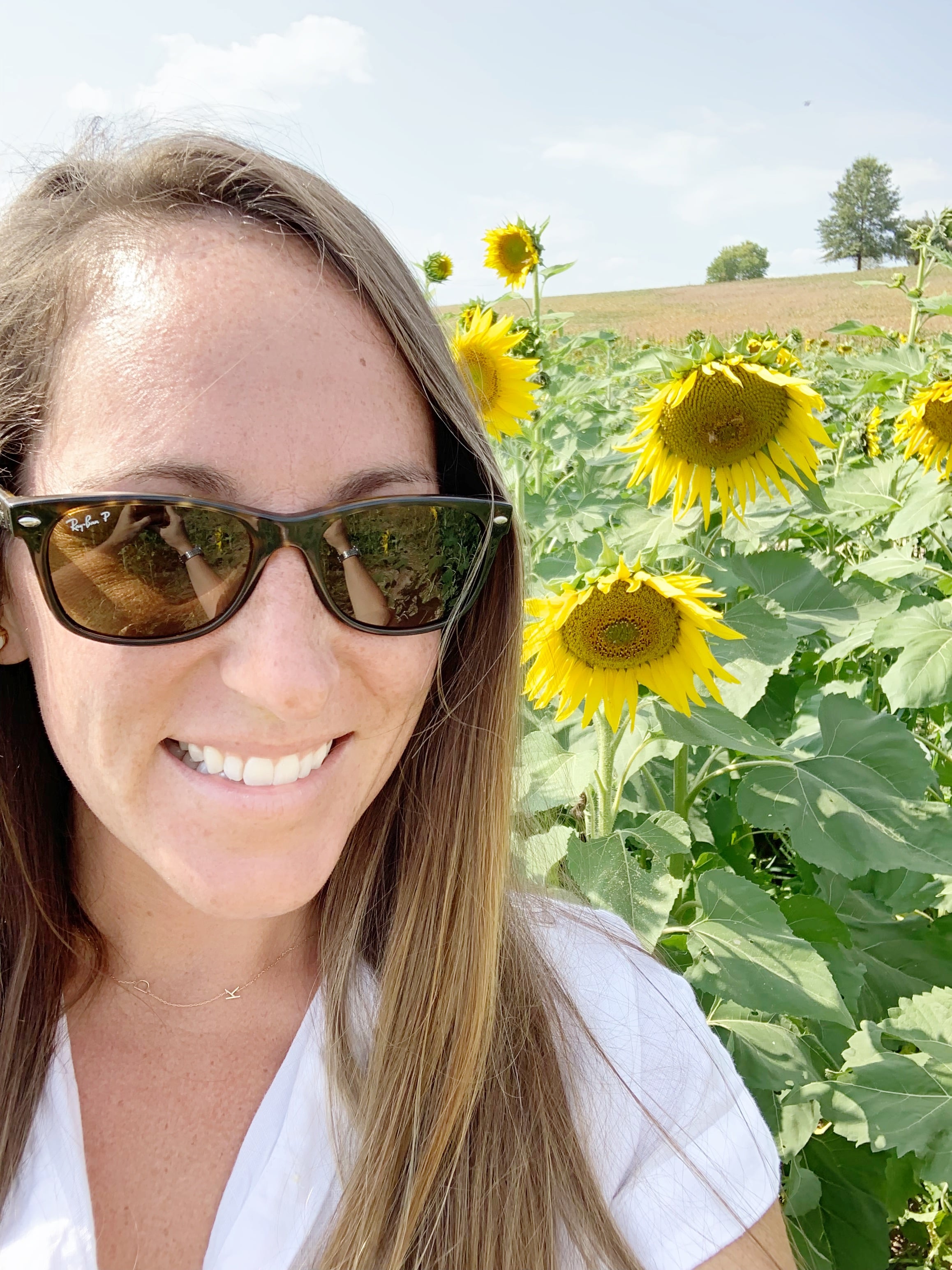 Woman in sunflower field 