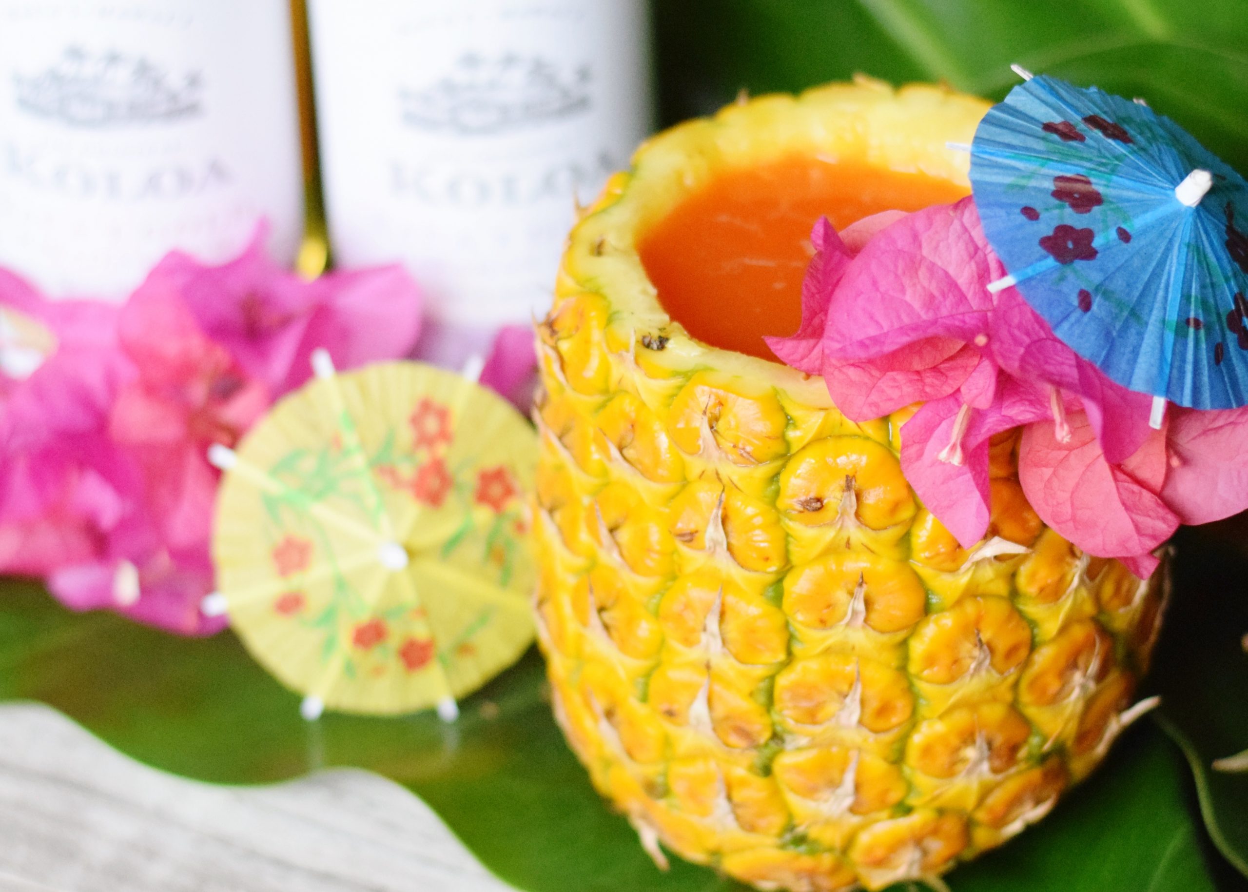Pacific Painkiller Cocktail With Kōloa Rum - A delicious mix of tropical juices and three types of Kōloa Rum, makes this the ultimate painkiller cocktail recipe! - Painkiller Cocktail Recipe - Painkiller Cocktail - Kōloa Rum - Kōloa Rum cocktail idea - Hawaii Tropical cocktail - Cocktail served in a pineapple 