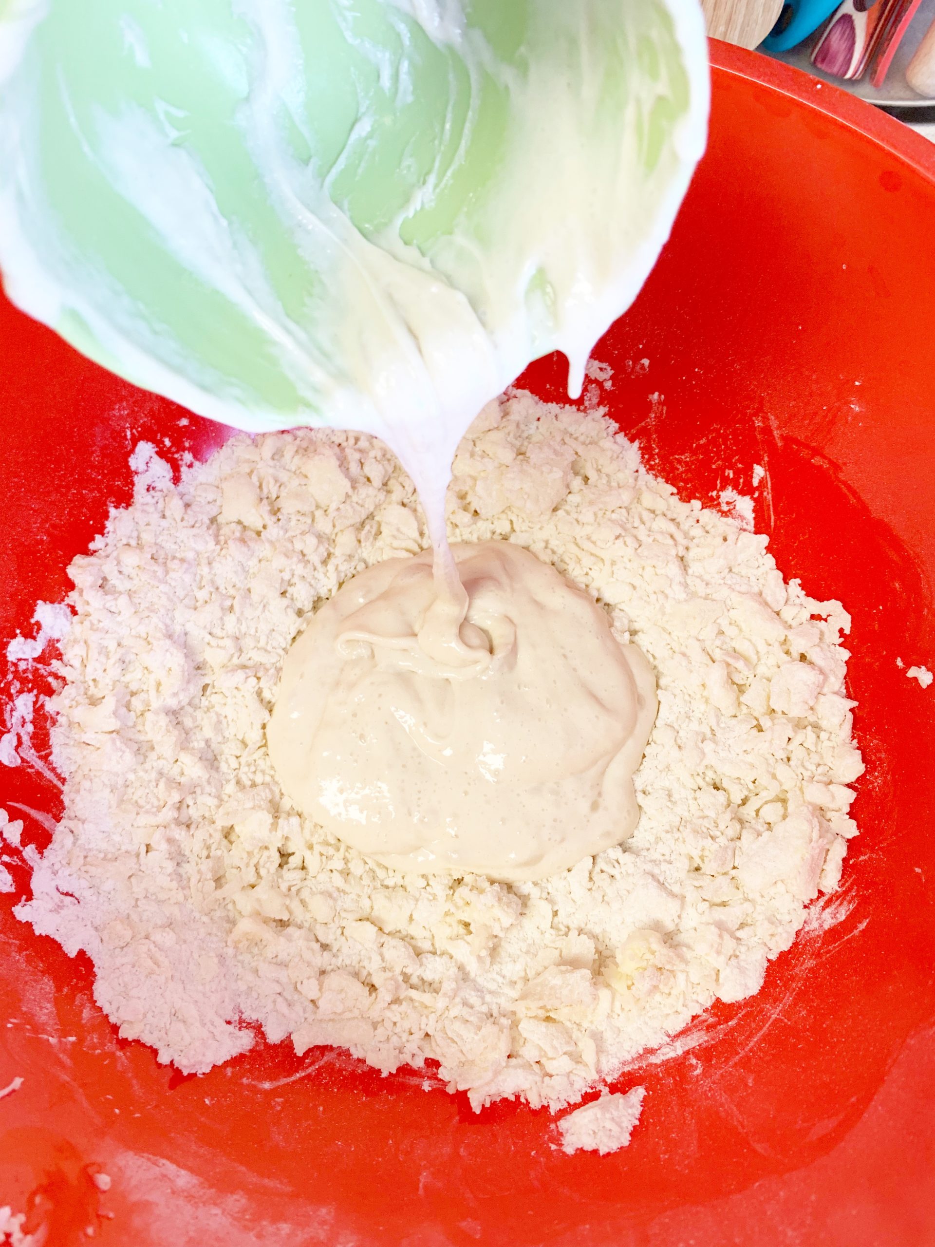 Adding sourdough starter into shaggy dough mix
