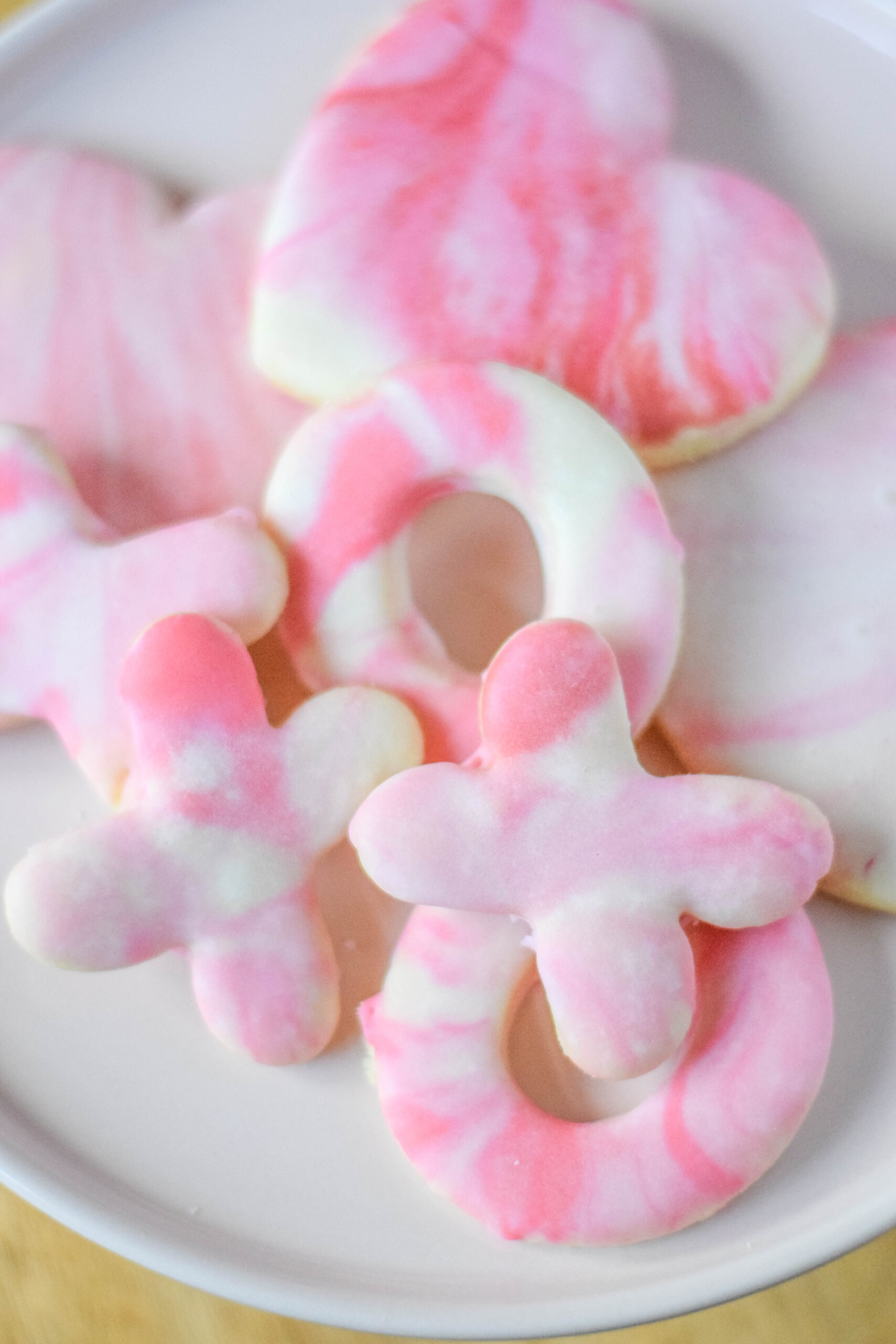 XOXO sugar cookies with red, pink, and white marble icing